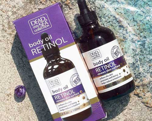 dead sea collection retinol oil in purple and white packaging